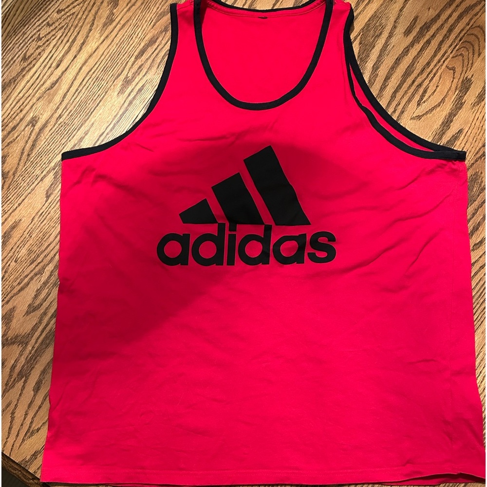 Red with blue lettering Adidas men’s tank top size large. New without tags.